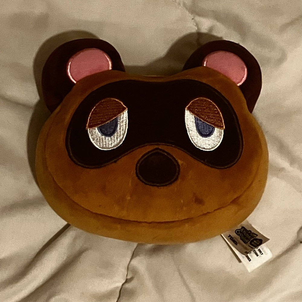 This is a Tom Nook plush! He is manufactured by “Club Mocchi-Mocchi”!